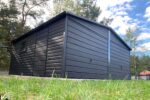 Garaż blaszany 6x5 - Dwustanowiskowy Dach dwuspadowy, Kolor antracyt, Bramy uchylne, Blachodachówka